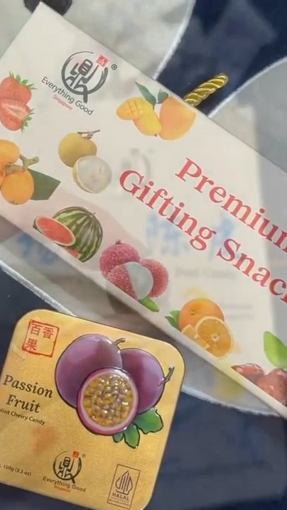 Everything Good Premium Gifting Snacks box and a Passion Fruit Mint Chewy Candy tin